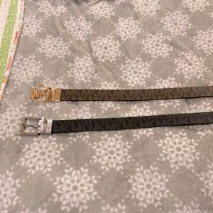 Two reversible Michael Kors belts one buckle is gold the other is silver